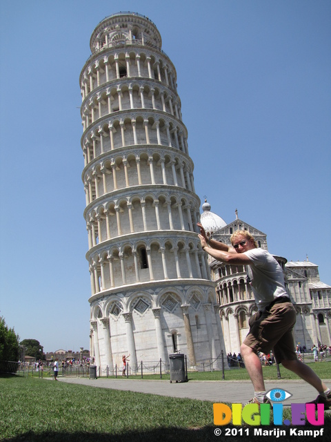 SX19774 Marijn pushing down leaning tower of Pisa, Italy